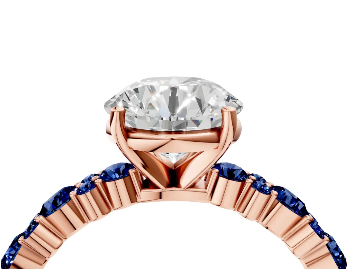 Round Cut Diamond Side Stone Solitaire Ring with Round Blue Sapphire and Four-Prong Setting Rose gold