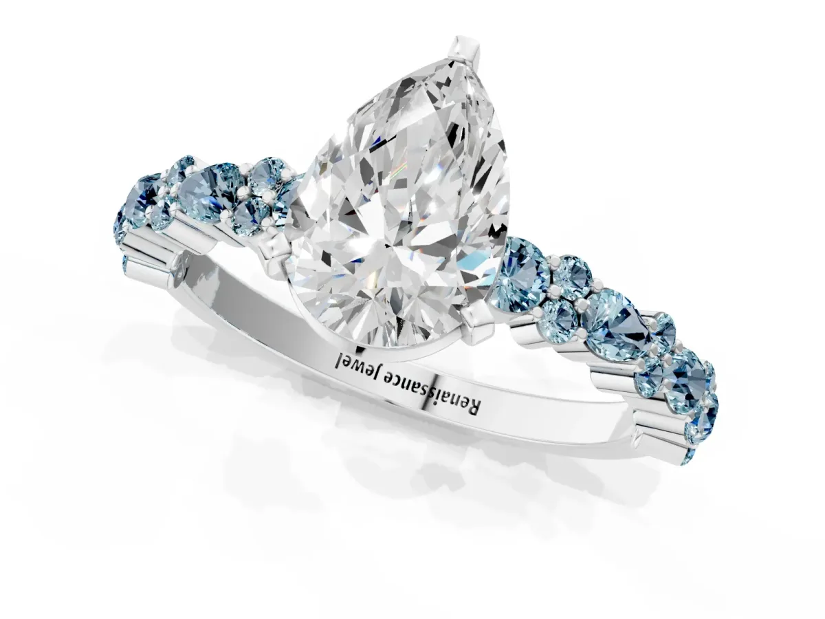 Pear Cut Diamond Side Stone Solitaire Ring with Round Aquamarine and Four-Prong Setting White gold
