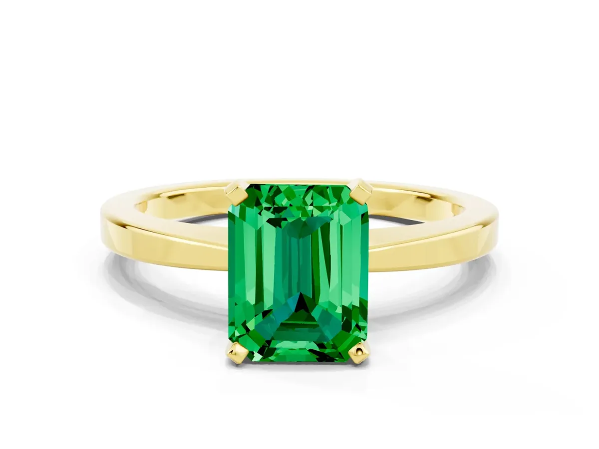 Emerald Cut Emerald Solitaire Engagement Ring with Classic Band and Four-Prong Setting Yellow gold