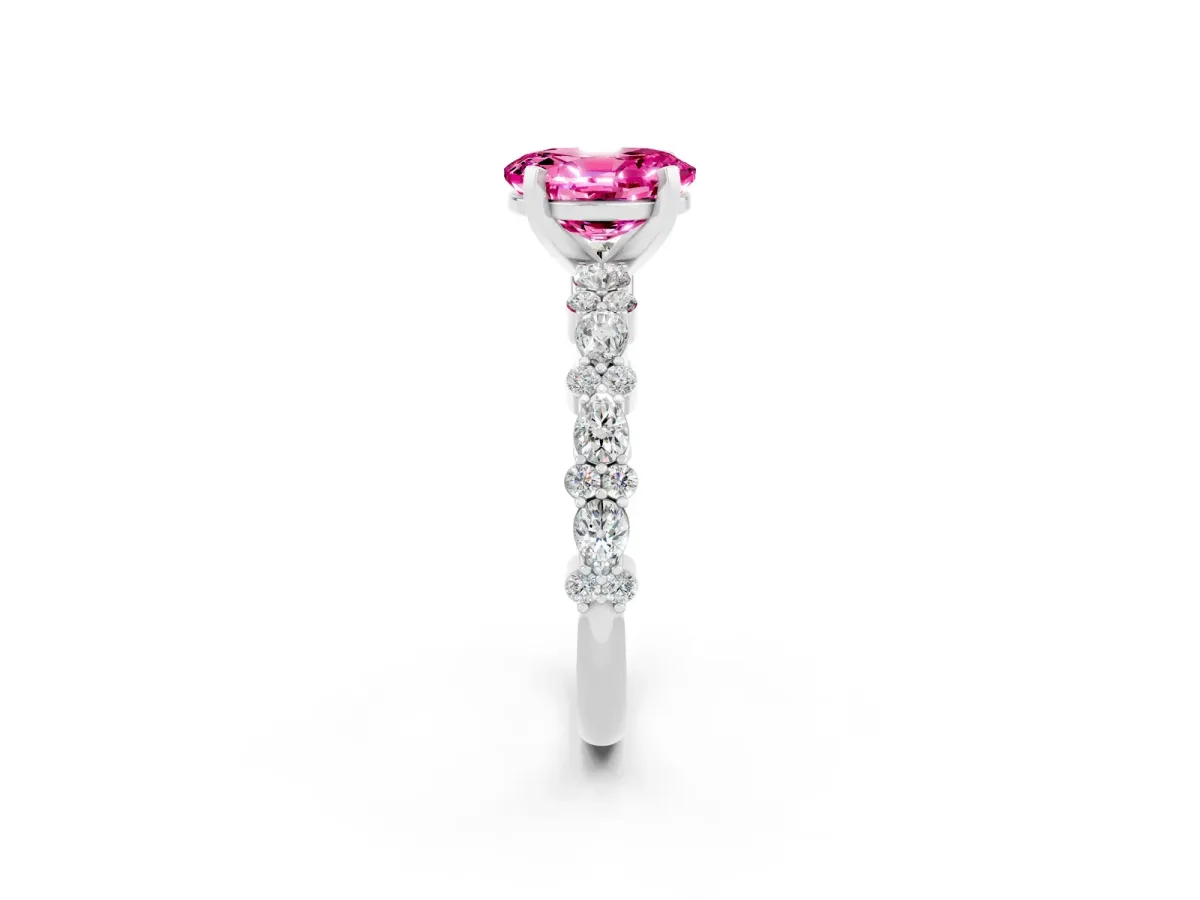 Oval Cut Pink Sapphire Side Stone Solitaire Ring with Round and Four-Prong Setting White gold