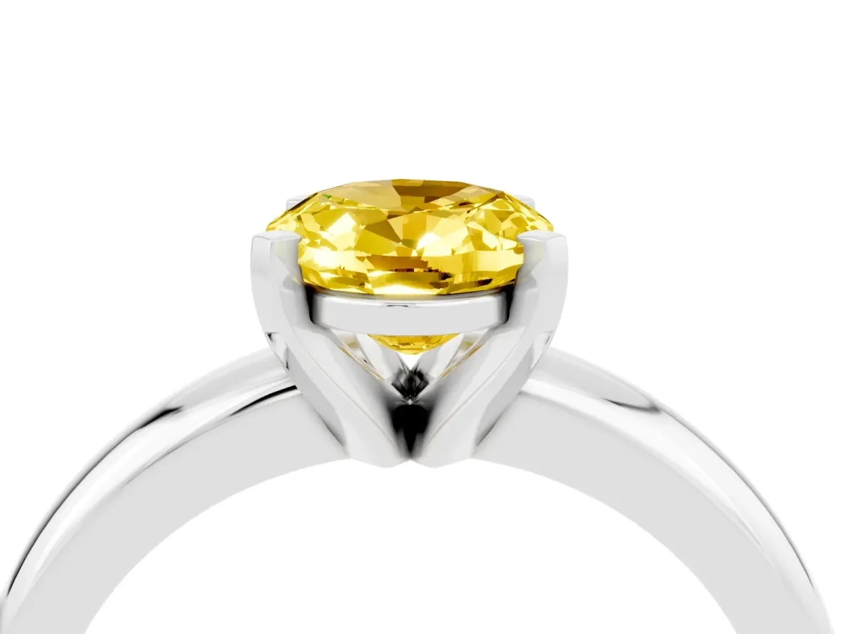 Oval Cut Yellow Sapphire Solitaire Engagement Ring with Round Band and Four-Prong Setting Silver