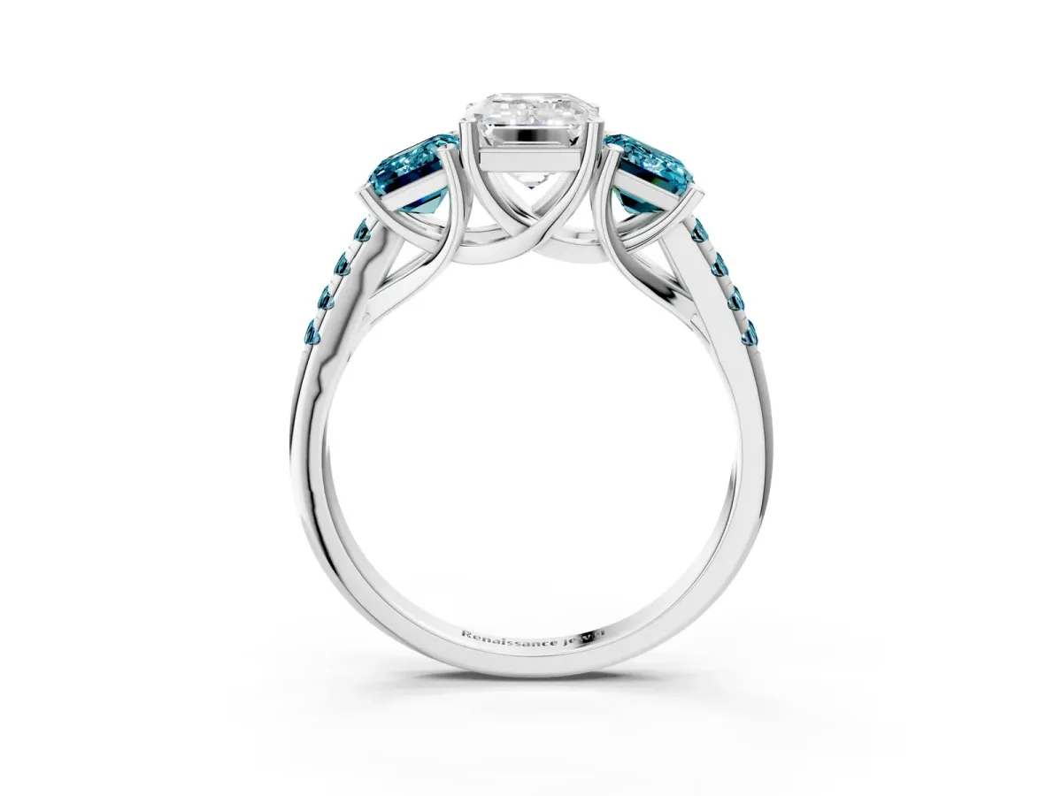 Three-Stone Emerald Cut Diamond Ring with Round Blue Topaz Pavé Band and Prong Setting Platinum