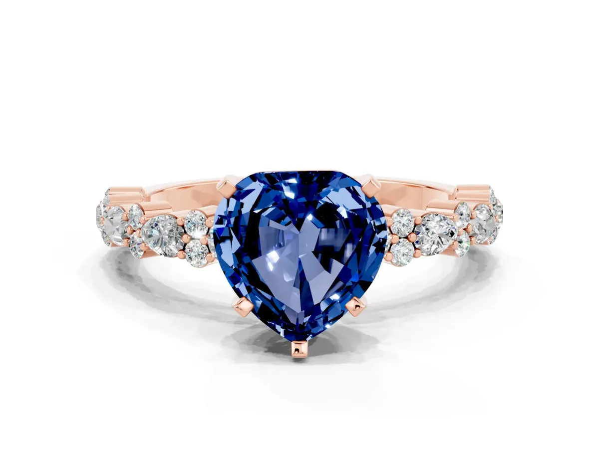 Heart Cut Blue Sapphire Side Stone Solitaire Ring with Round and Four-Prong Setting Rose gold