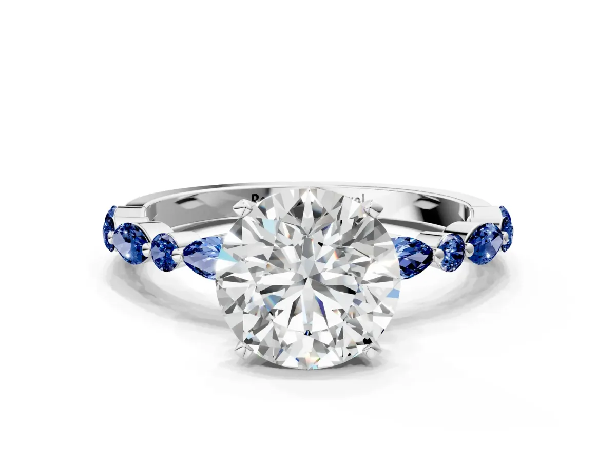 Round Cut Diamond Ring with Marquise and Round Blue Sapphire Side Stones and Four-Prong Setting Silver
