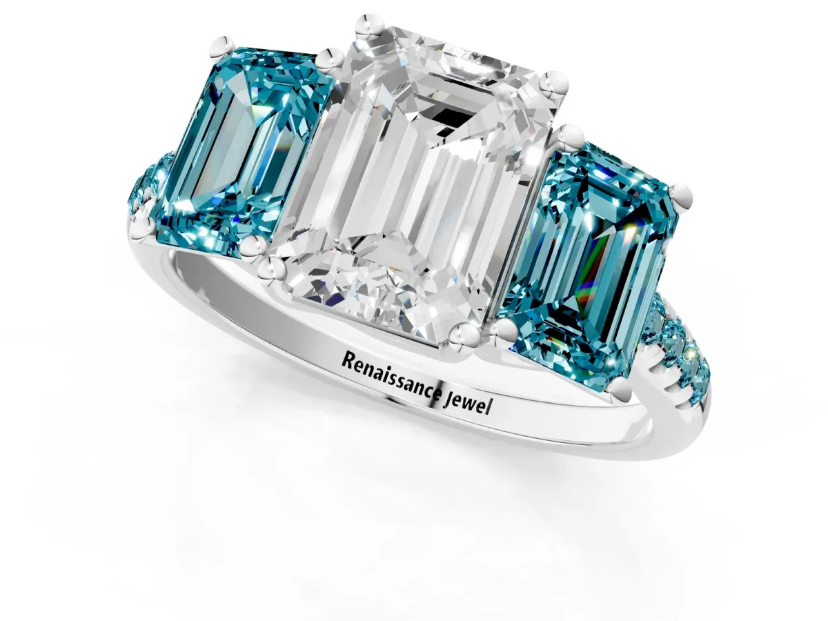 Three-Stone Emerald Cut Diamond Ring with Round Blue Topaz Pavé Band and Prong Setting Platinum