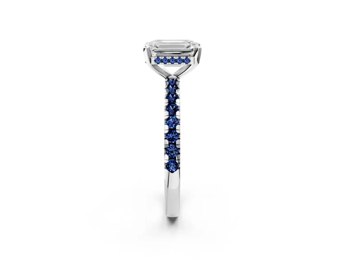 Emerald Cut Diamond Solitaire Ring with Round Blue Sapphire Pavé Band and Four-Prong Setting Silver