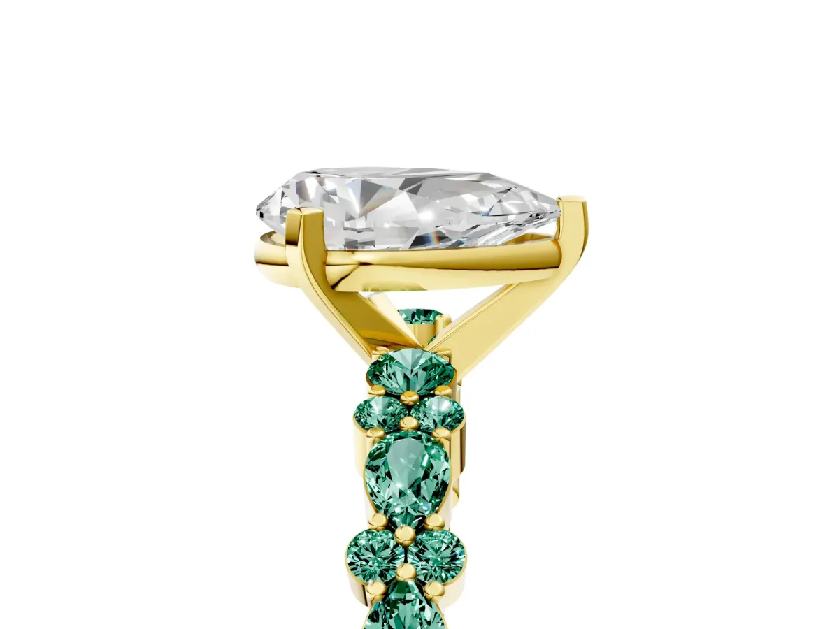 Pear Cut Diamond Side Stone Solitaire Ring with Round Green Sapphire and Four-Prong Setting Yellow gold