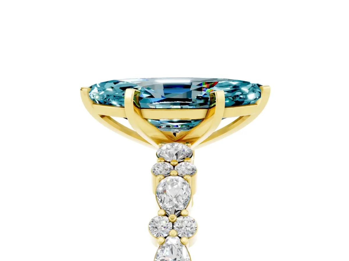 Marquise Cut Blue Topaz Side Stone Solitaire Ring with Round and Four-Prong Setting Yellow gold