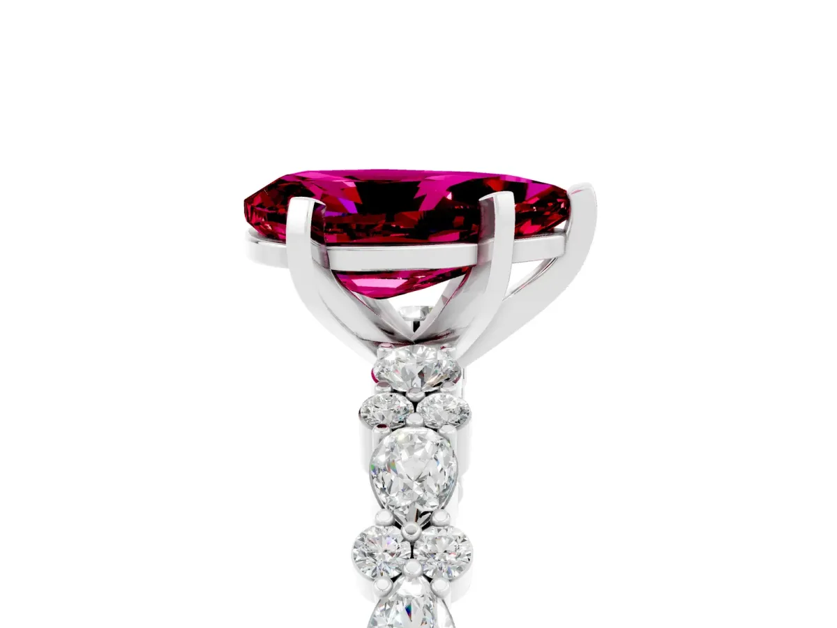 Pear Cut Garnet Side Stone Solitaire Ring with Round and Four-Prong Setting Silver
