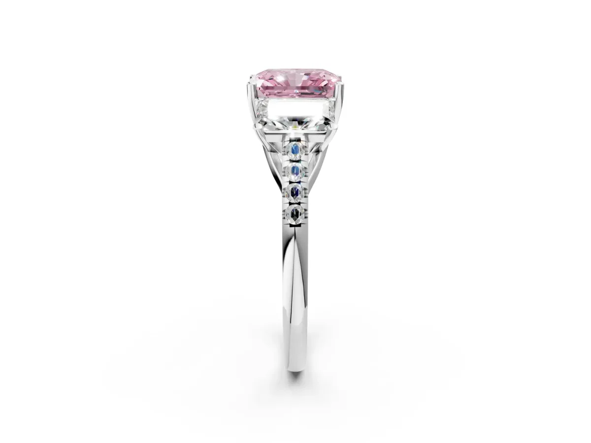 Fancy Pink Three-Stone Radiant Cut Diamond Ring with Round Pavé Band and Prong Setting Platinum