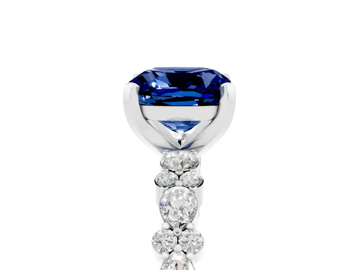 Cushion Cut Blue Sapphire Side Stone Solitaire Ring with Round and Four-Prong Setting Platinum