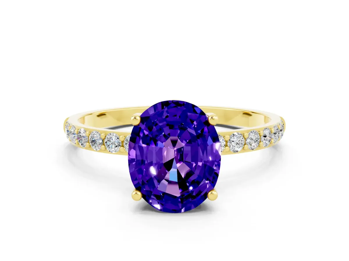 Oval Cut Tanzanite Solitaire Ring with Round Pavé Band and Prong Setting Yellow gold