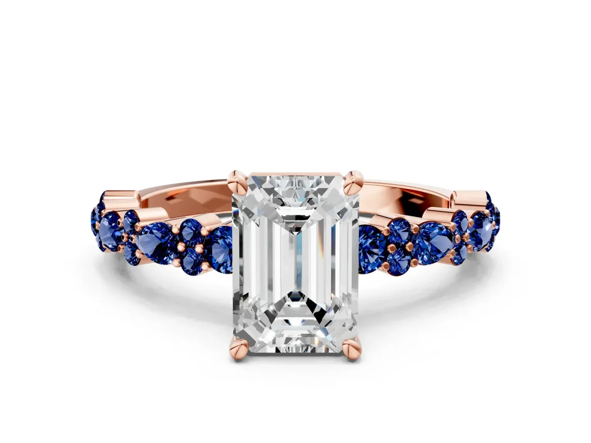 Emerald Cut Diamond Side Stone Solitaire Ring with Round Blue Sapphire and Four-Prong Setting Rose gold