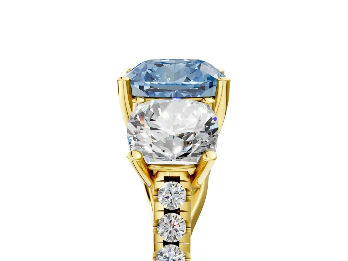 Fancy Blue Three-Stone Cushion Cut Diamond Ring with Round Pavé Band and Prong Setting Yellow gold