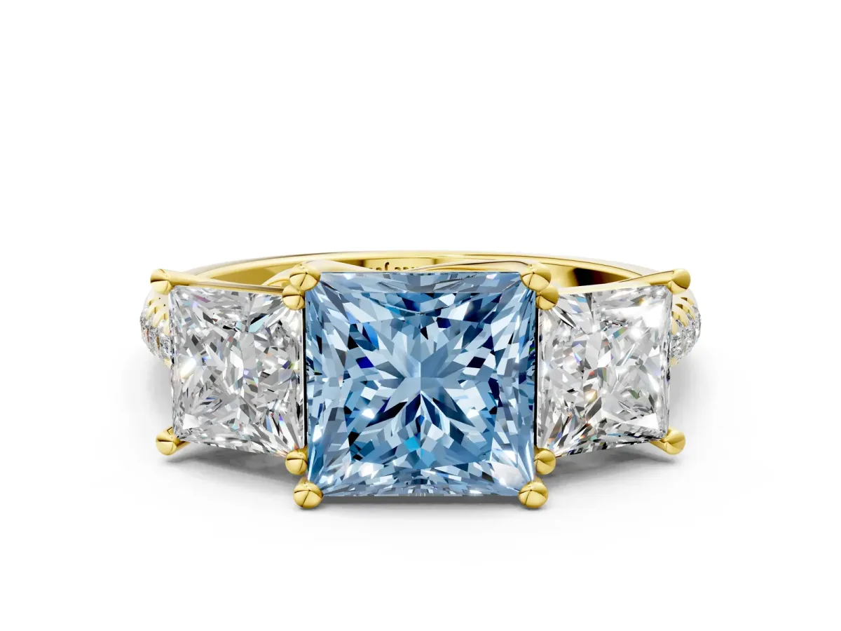 Fancy Blue Three-Stone Princess Cut Diamond Ring with Round Pavé Band and Prong Setting Yellow gold