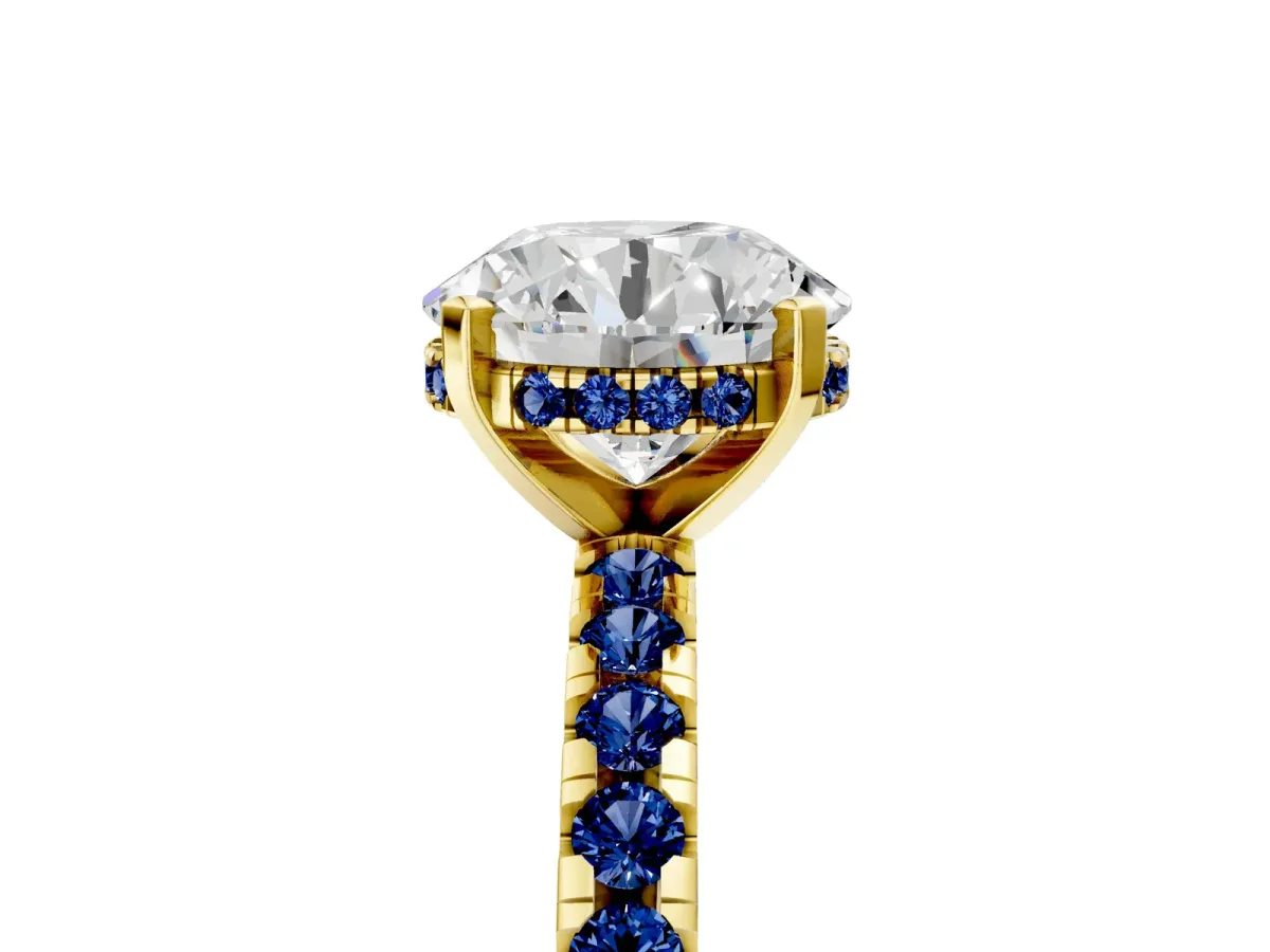 Round Cut Diamond Solitaire Ring with Round Blue Sapphire Pavé Band and Four-Prong Setting Yellow gold