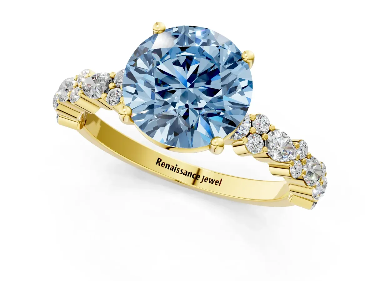 Fancy Blue Round Cut Diamond Side Stone Solitaire Ring with Round and Four-Prong Setting Yellow gold