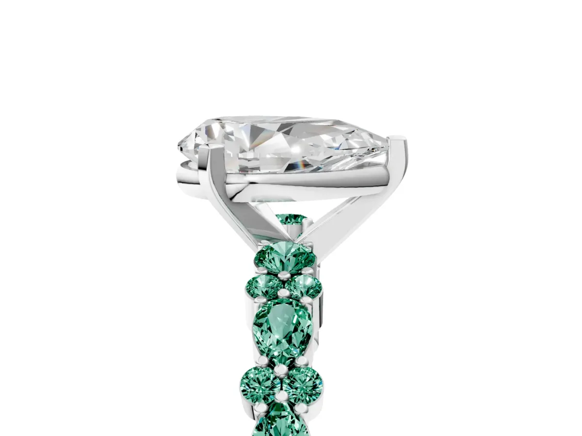 Pear Cut Diamond Side Stone Solitaire Ring with Round Green Sapphire and Four-Prong Setting Platinum