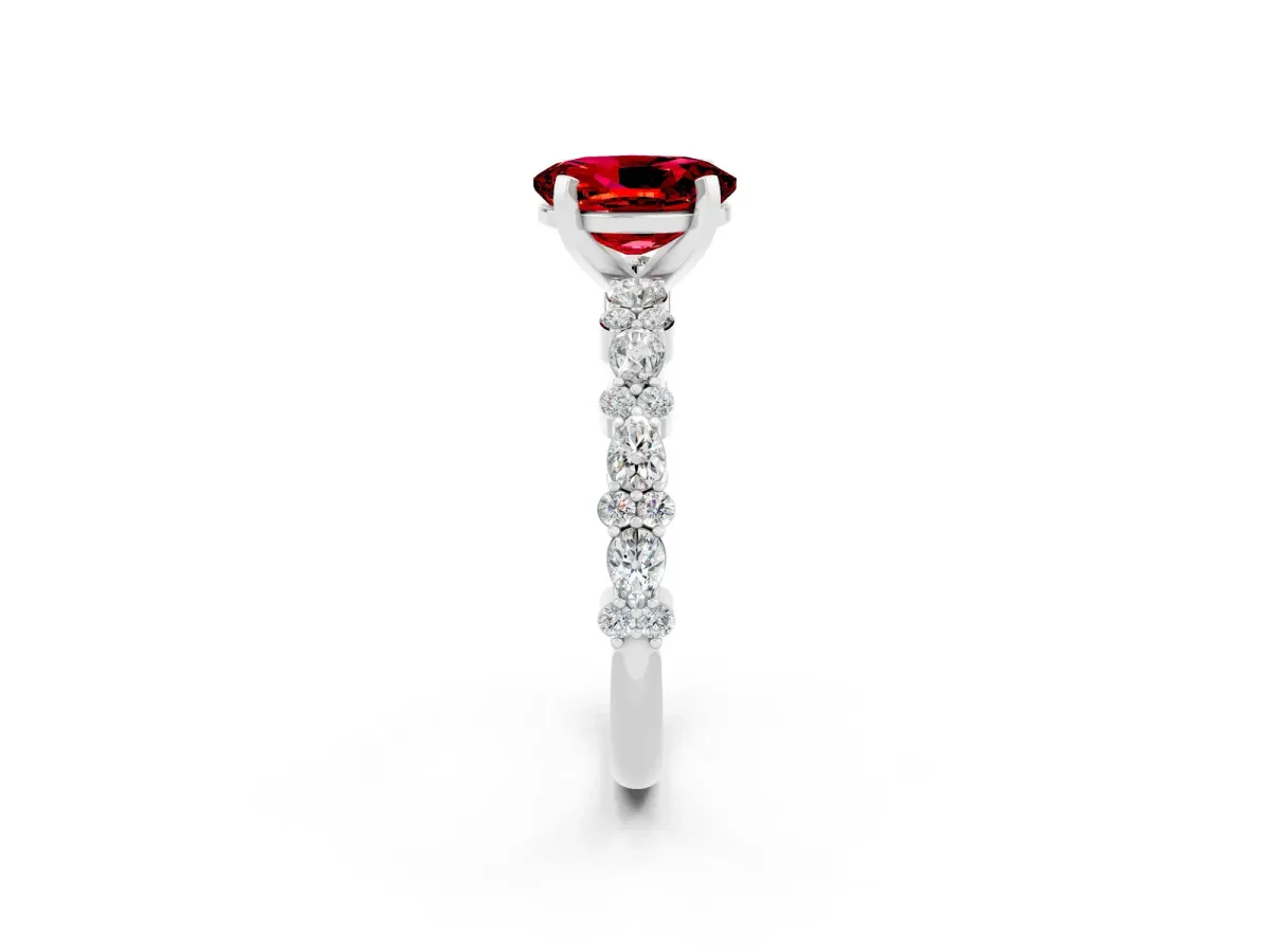 Oval Cut Ruby Side Stone Solitaire Ring with Round and Four-Prong Setting White gold