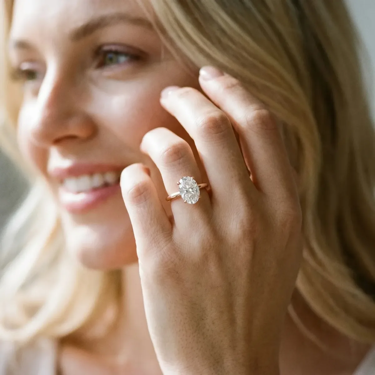Oval Cut Diamond Solitaire Engagement Ring with Classic Band and Four-Prong Setting Rose gold