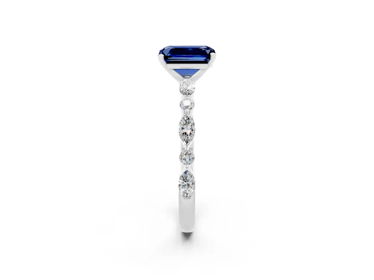 Emerald Cut Blue Sapphire Ring with Marquise and Round Side Stones and Four-Prong Setting Silver