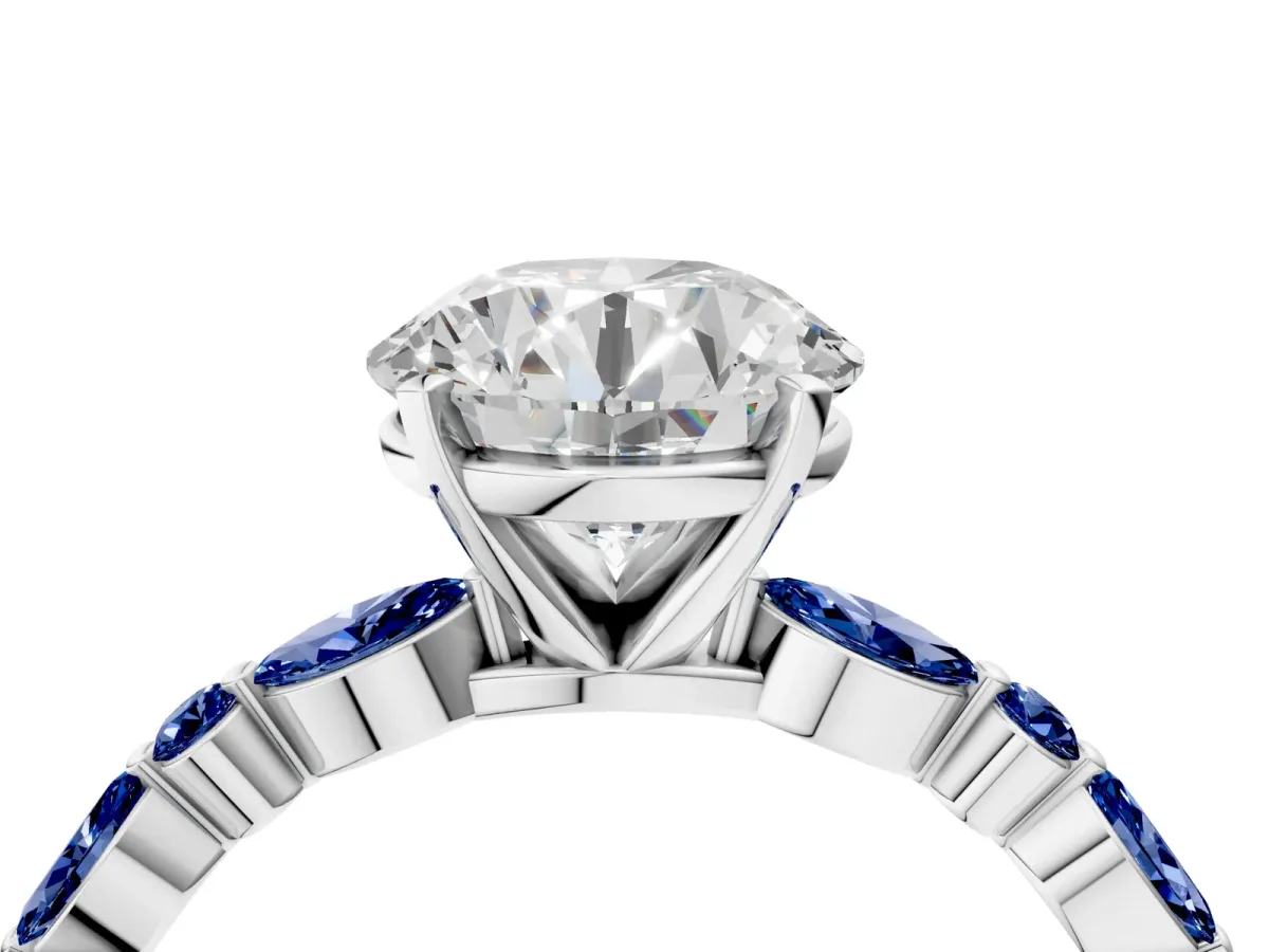Round Cut Diamond Ring with Marquise and Round Blue Sapphire Side Stones and Four-Prong Setting Silver