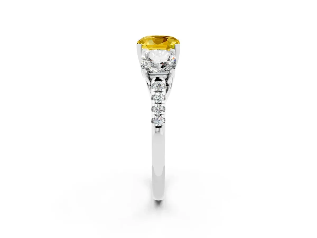 Three-Stone Cushion Cut Yellow Sapphire Ring with Round Pavé Band and Prong Setting Platinum