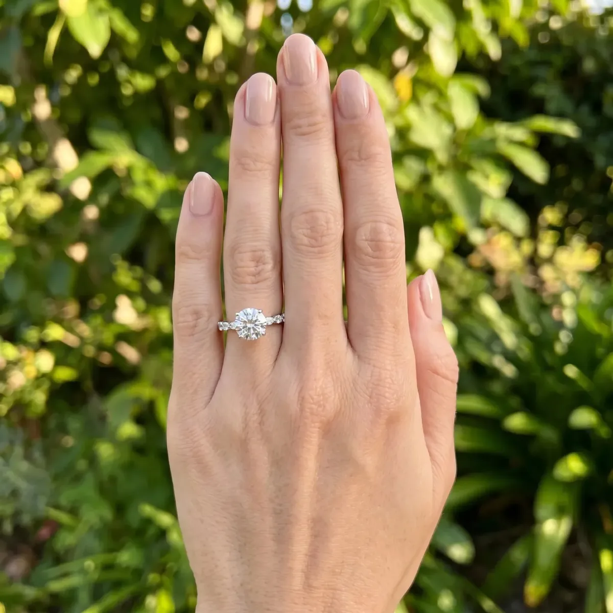 Round Cut Diamond Ring with Marquise and Round Side Stones and Four-Prong Setting White gold