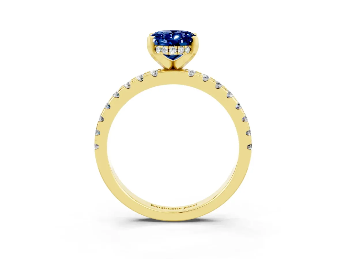 Oval Cut Blue Sapphire Solitaire Ring with Round Pavé Band and Four-Prong Setting Yellow gold