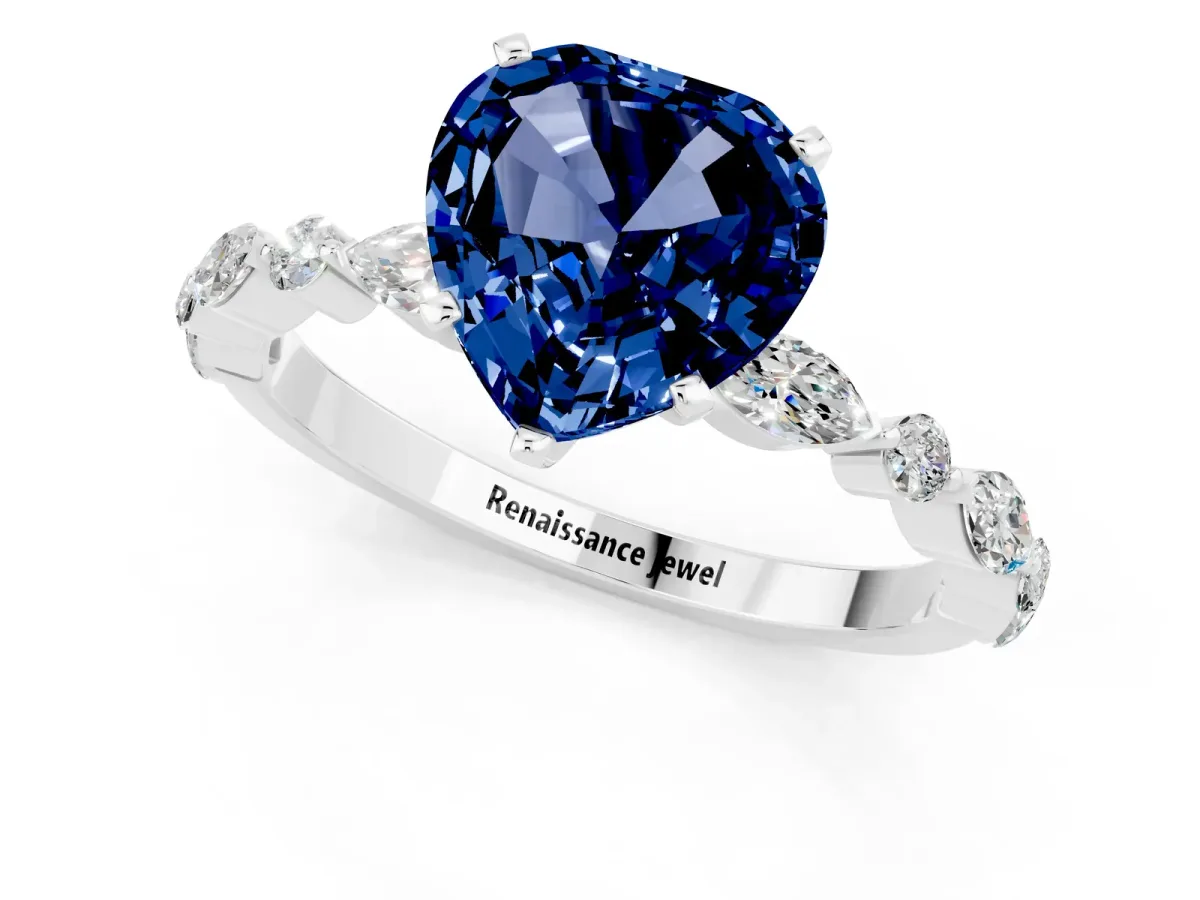 Heart Cut Blue Sapphire Ring with Marquise and Round Side Stones and Four-Prong Setting Silver