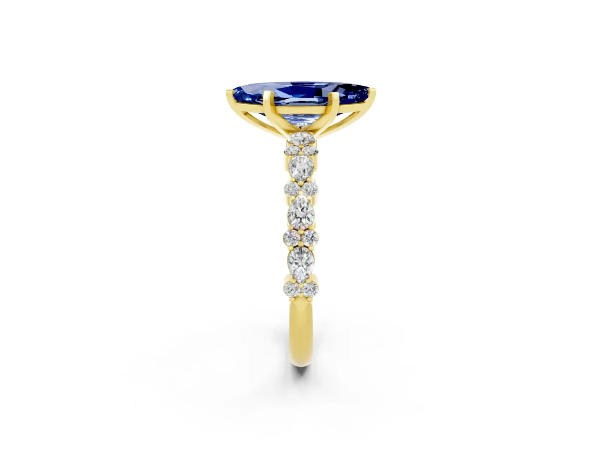 Marquise Cut Blue Sapphire Side Stone Solitaire Ring with Round and Four-Prong Setting Yellow gold