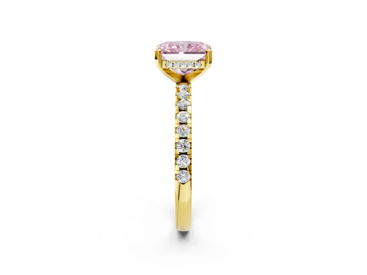 Fancy Pink Radiant Cut Diamond Solitaire Ring with Round Pavé Band and Four-Prong Setting Yellow gold