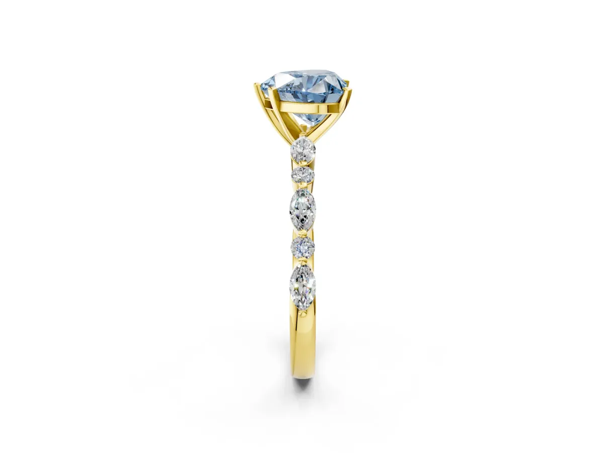 Fancy Blue Heart Cut Diamond Ring with Marquise and Round Side Stones and Four-Prong Setting Yellow gold