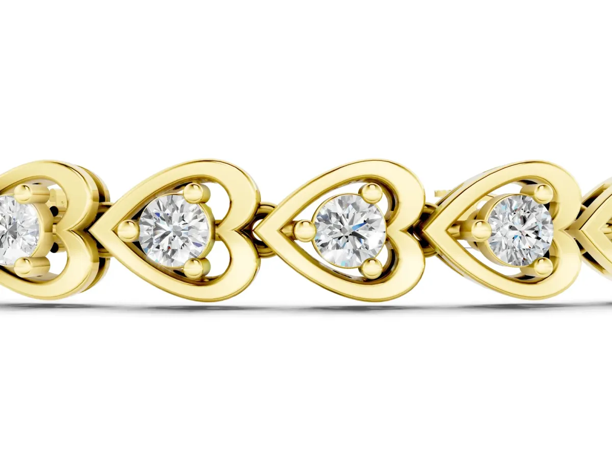 Heart-Shaped Diamond Tennis Bracelet with Channel Setting and Four-Prong Setting Yellow gold
