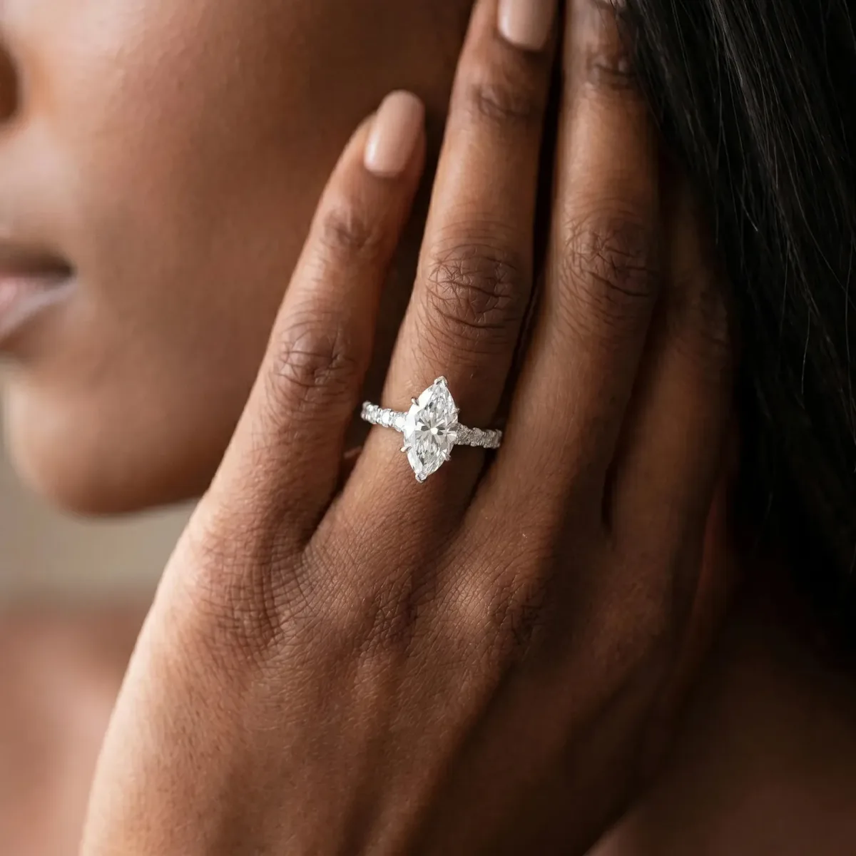 Marquise Cut Diamond Side Stone Solitaire Ring with Round and Four-Prong Setting Platinum