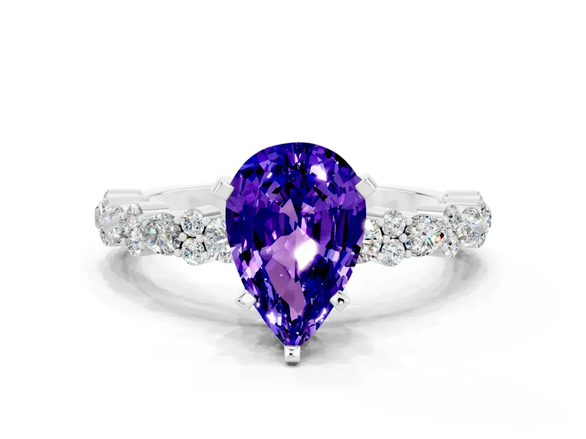 Pear Cut Tanzanite Side Stone Solitaire Ring with Round and Four-Prong Setting Silver