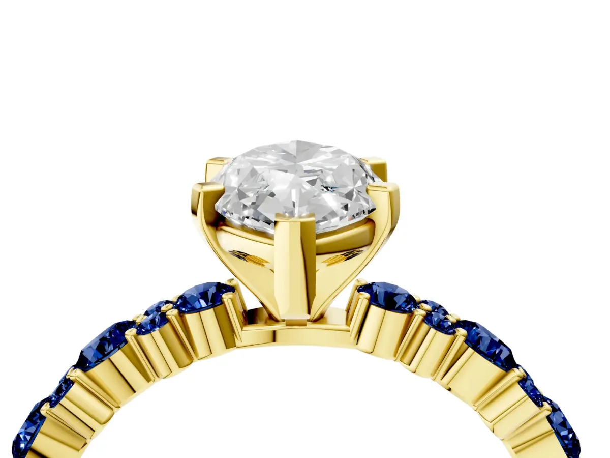 Marquise Cut Diamond Side Stone Solitaire Ring with Round Blue Sapphire and Four-Prong Setting Yellow gold