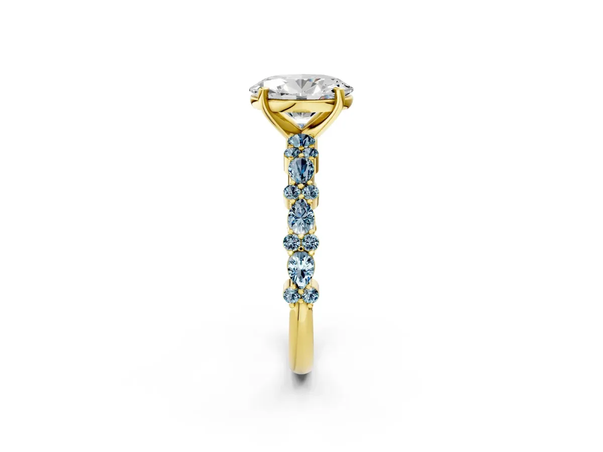 Oval Cut Diamond Side Stone Solitaire Ring with Round Aquamarine and Four-Prong Setting Yellow gold