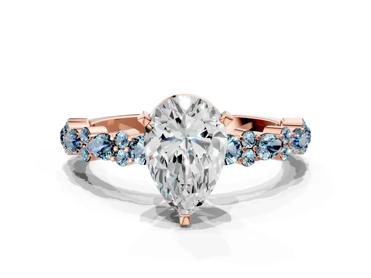 Pear Cut Diamond Side Stone Solitaire Ring with Round Aquamarine and Four-Prong Setting Rose gold