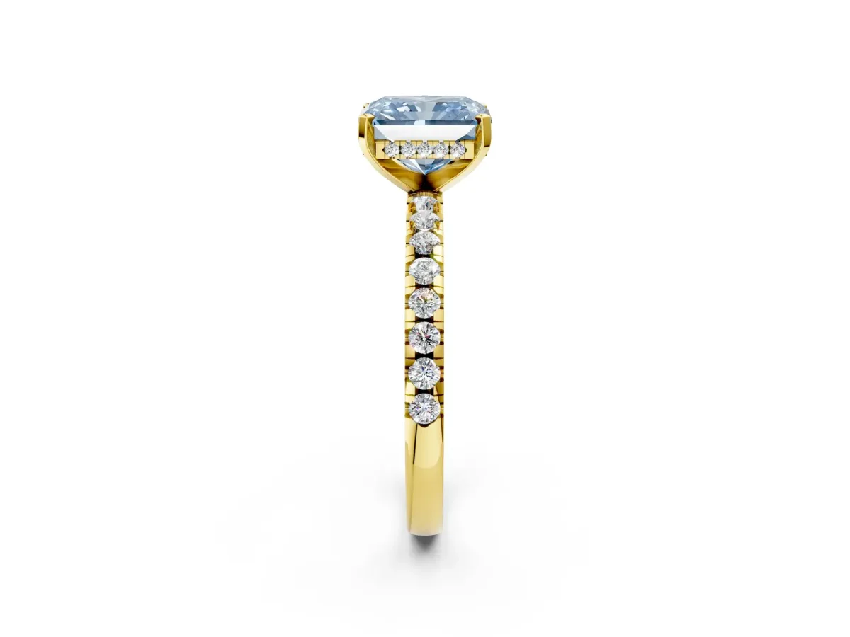 Fancy Blue Radiant Cut Diamond Solitaire Ring with Round Pavé Band and Four-Prong Setting Yellow gold