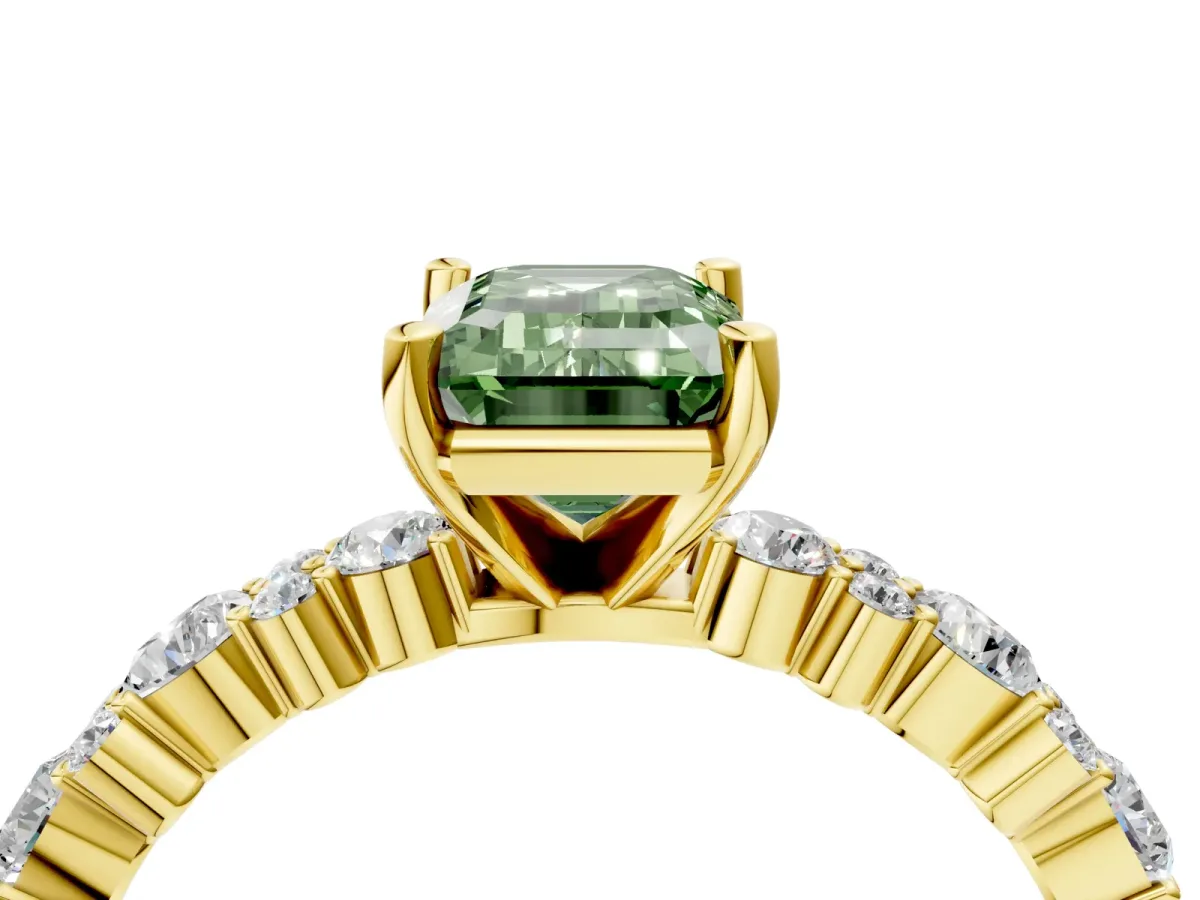 Fancy Green Emerald Cut Diamond Side Stone Solitaire Ring with Round and Four-Prong Setting Yellow gold