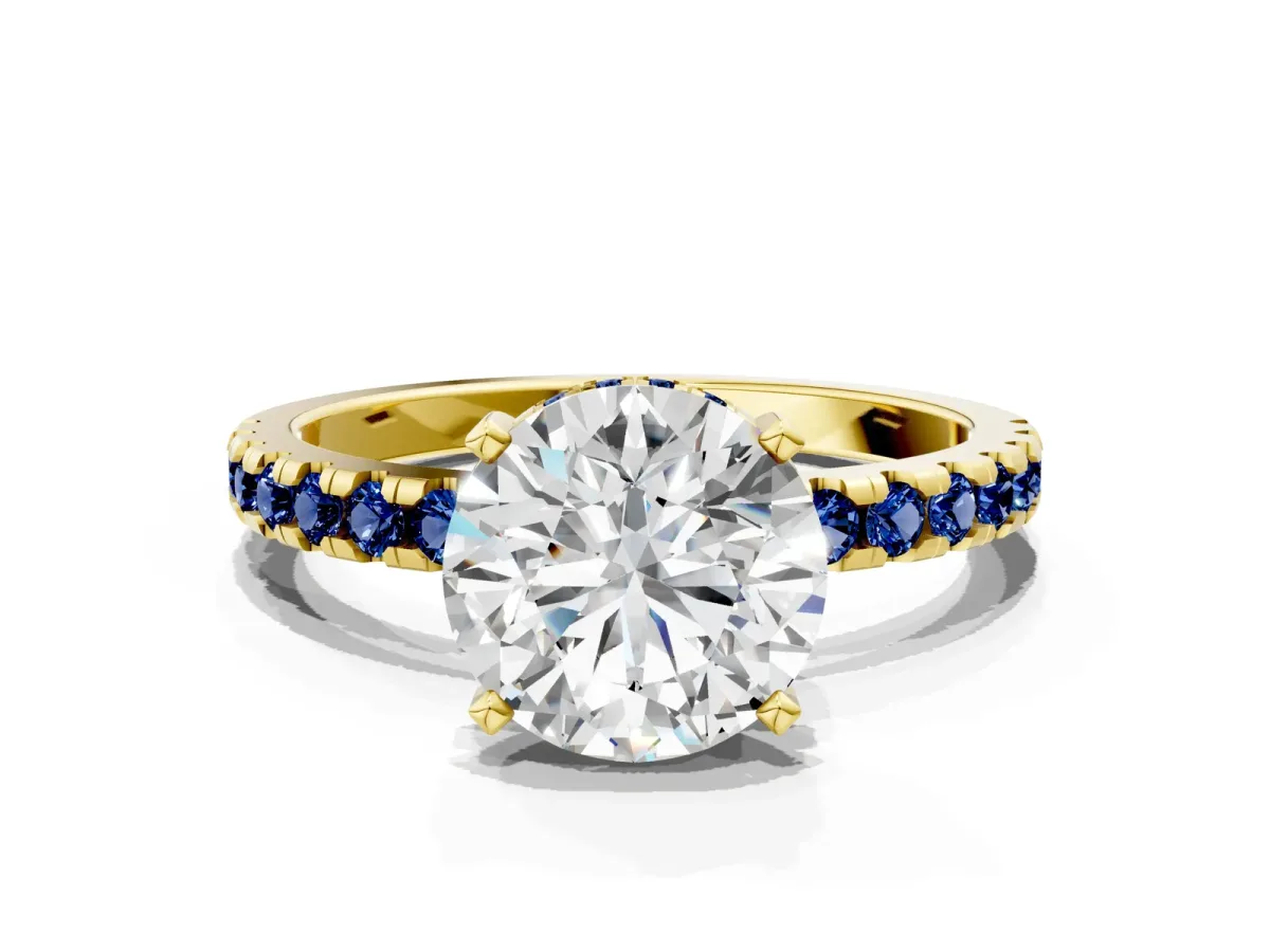 Round Cut Diamond Solitaire Ring with Round Blue Sapphire Pavé Band and Four-Prong Setting Yellow gold