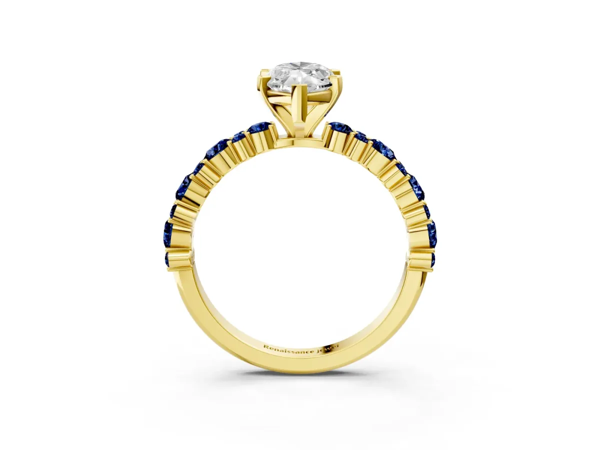 Marquise Cut Diamond Side Stone Solitaire Ring with Round Blue Sapphire and Four-Prong Setting Yellow gold