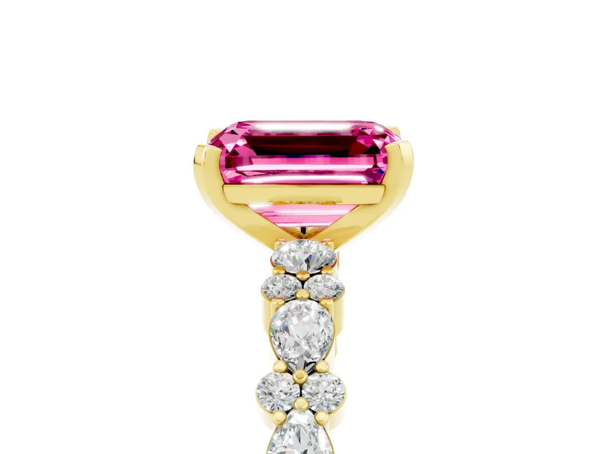 Emerald Cut Pink Sapphire Side Stone Solitaire Ring with Round and Four-Prong Setting Yellow gold