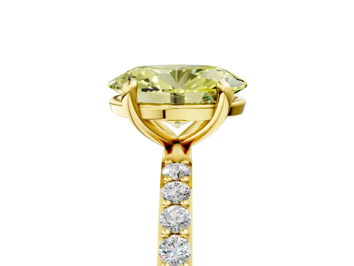Fancy Yellow Oval Cut Diamond Solitaire Ring with Round Pavé Band and Prong Setting Yellow gold