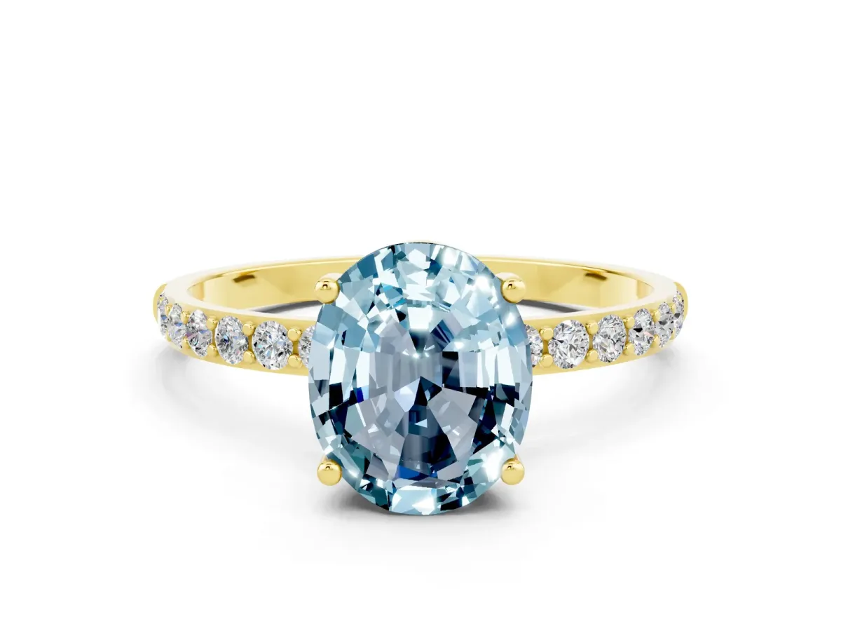 Oval Cut Aquamarine Solitaire Ring with Round Pavé Band and Prong Setting Yellow gold