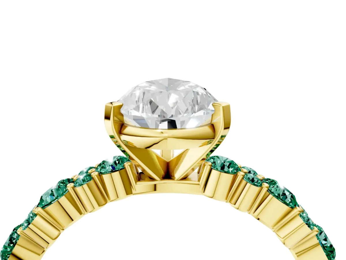 Pear Cut Diamond Side Stone Solitaire Ring with Round Green Sapphire and Four-Prong Setting Yellow gold