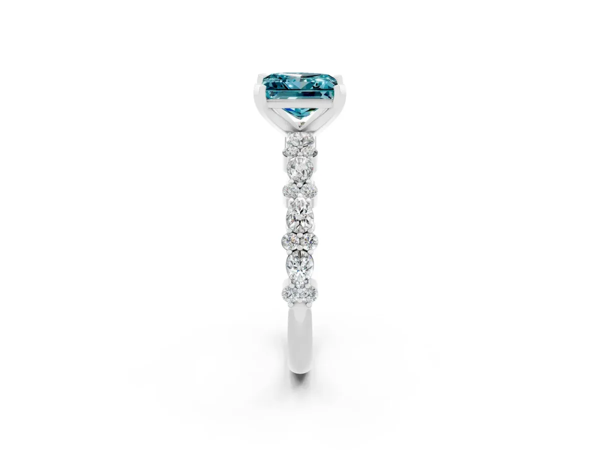 Princess Cut Blue Topaz Side Stone Solitaire Ring with Round and Four-Prong Setting Silver