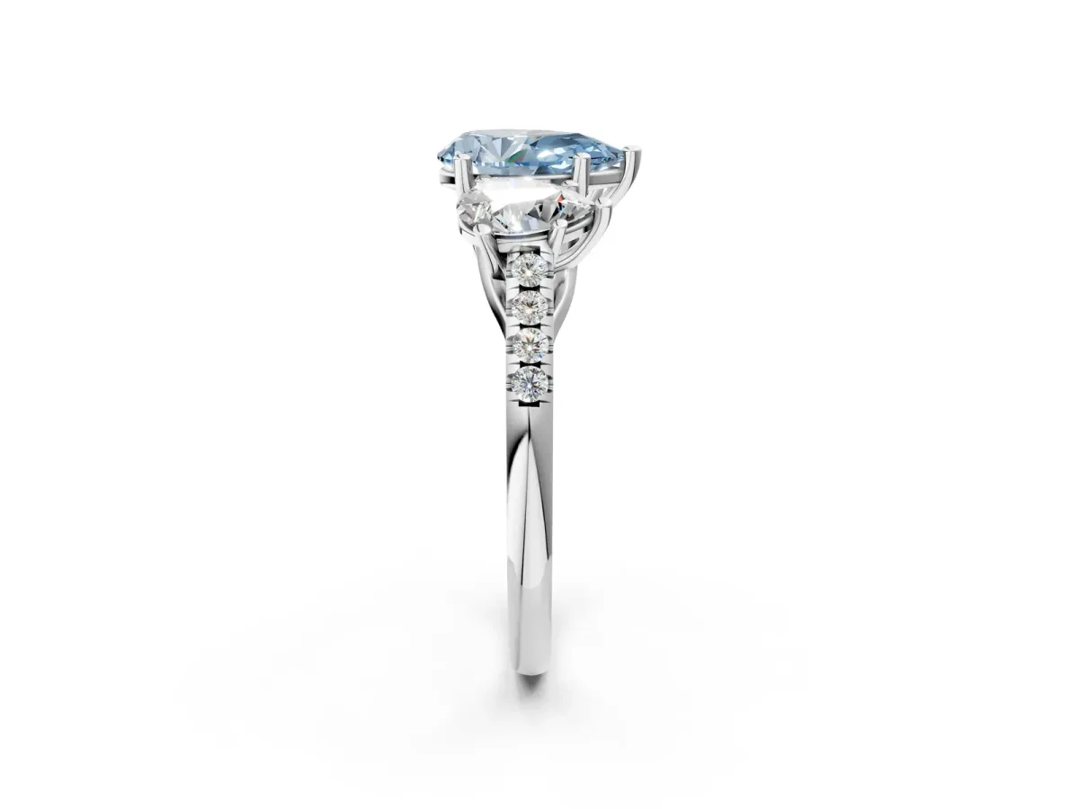 Fancy Blue Three-Stone Pear Cut Diamond Ring with Round Pavé Band and Prong Setting Silver
