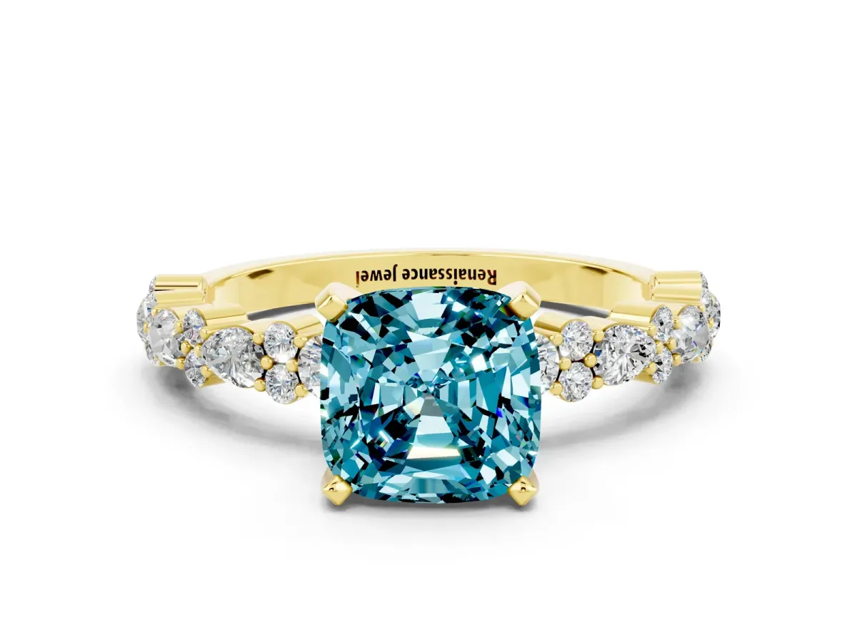 Cushion Cut Blue Topaz Side Stone Solitaire Ring with Round and Four-Prong Setting Yellow gold